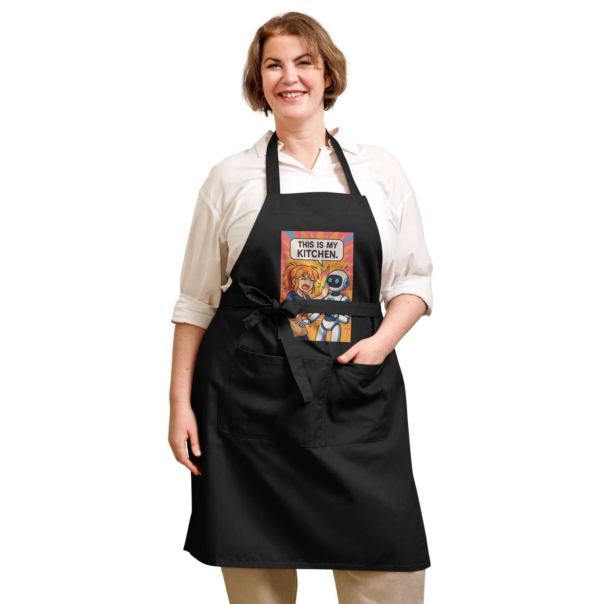 Woman wearing an Organic cotton apron in a stylish black design with a fun kitchen graphic.